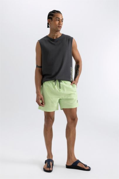 Short de bain avec doublure en filet