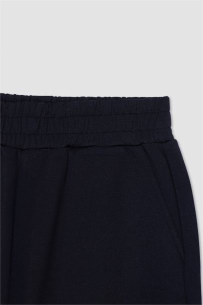 Pantalon Jogging en tissu scuba à poches plaquées