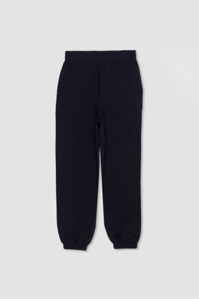 Pantalon Jogging en tissu scuba à poches plaquées