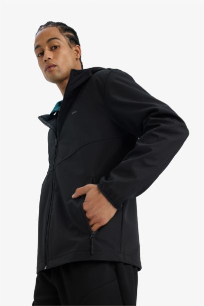 جاكيت مطر قصة عادية بغطاء للرأس مقاوم للماء من DeFactoFit