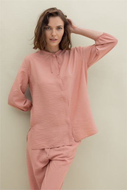 قميص واسع كم طويل برقبة مدورة