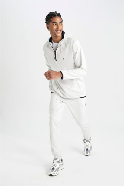 بنطلون جوجر قماش سكوبا سليم فيت بأستك من تحت من DeFactoFit