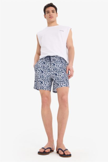 Short de bain court imprimé avec doublure en filet