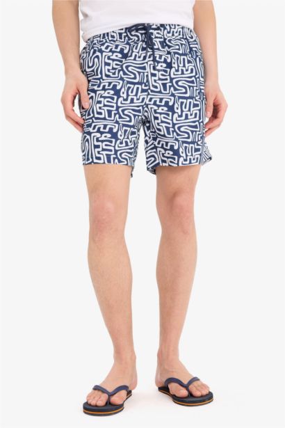 Short de bain court imprimé avec doublure en filet