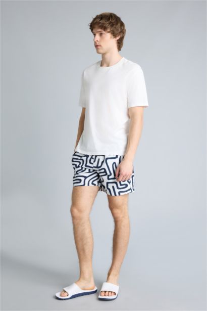 Short de bain court imprimé avec doublure en filet