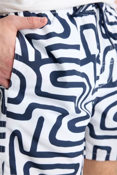 Short de bain court imprimé avec doublure en filet