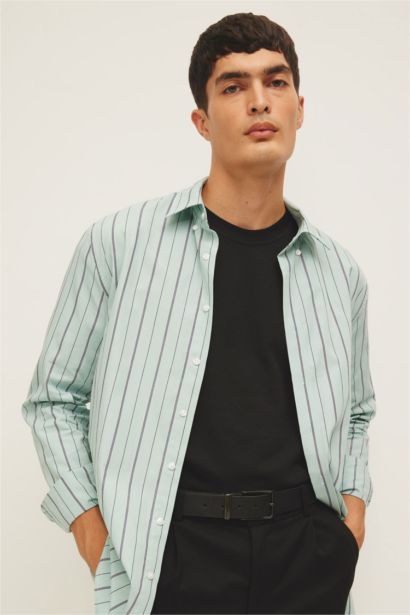 قميص بولو مخطط كم طويل مودرن فيت