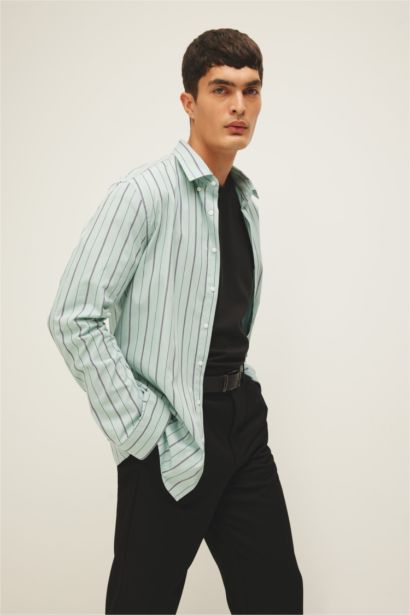 قميص بولو مخطط كم طويل مودرن فيت