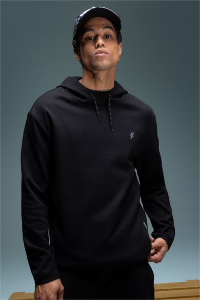 سويت شيرت قصة عادية بغطاء للرأس من DeFactoFit