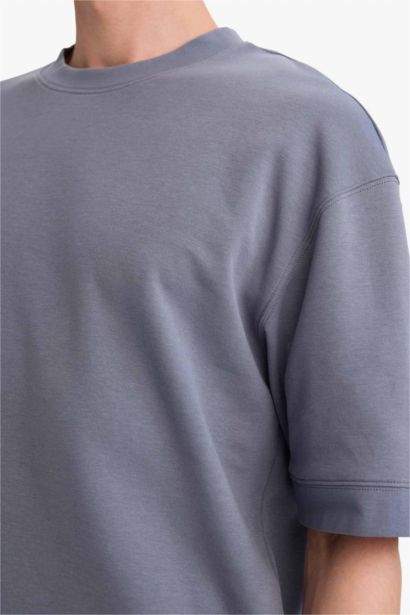 تيشيرت نص كم قصة فضفاضة قماش يسمح بمرور الهواء