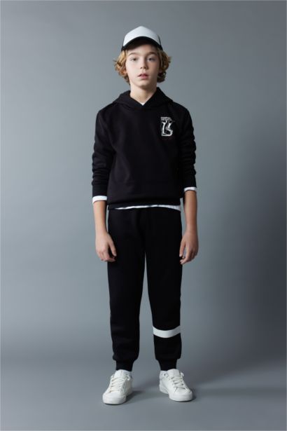 بنطلون سويت بانتس اولادي تقيل قصة عادية بأستك من تحت