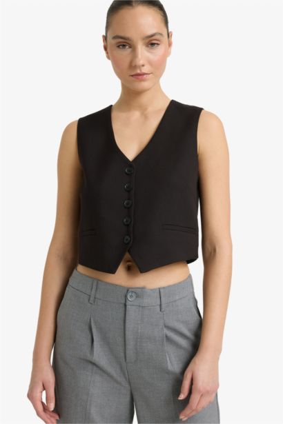 Gilet noir à boutons