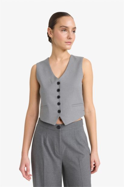 Gilet gris à boutons