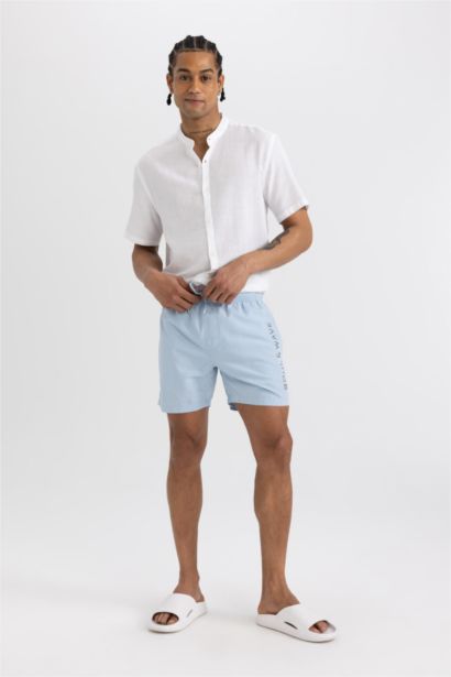 Short de bain avec doublure en filet