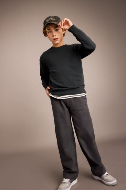 سويت شيرت اولادي قصة عادية بجيب وتأثير باهت