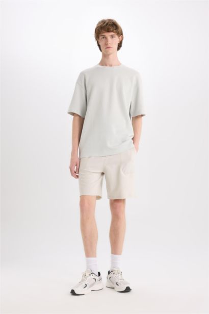 شورت سادة بيزك قطن سليم فيت بجيب