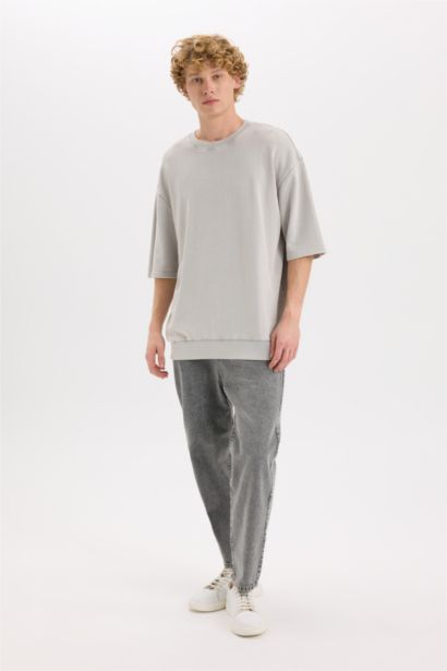 تيشيرت نص كم قصة فضفاضة برقبة مستديرة