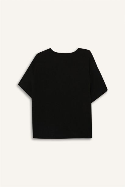 تيشيرت اسود سادة منسوج قصة مريحة بياخة مستديرة