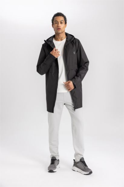 بالطو مطر قصة عادية بغطاء للرأس طارد للماء من DeFactoFit