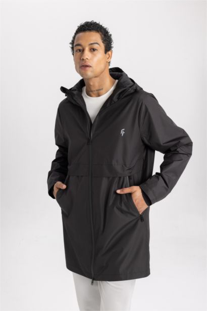 بالطو مطر قصة عادية بغطاء للرأس طارد للماء من DeFactoFit