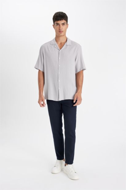 قميص بولو نص كم محبوك قصة مريحة