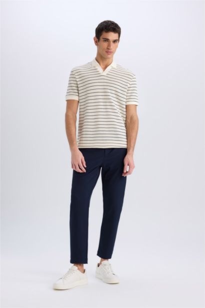 T-shirt Polo rayé en maille à manches courtes et coupe régulière