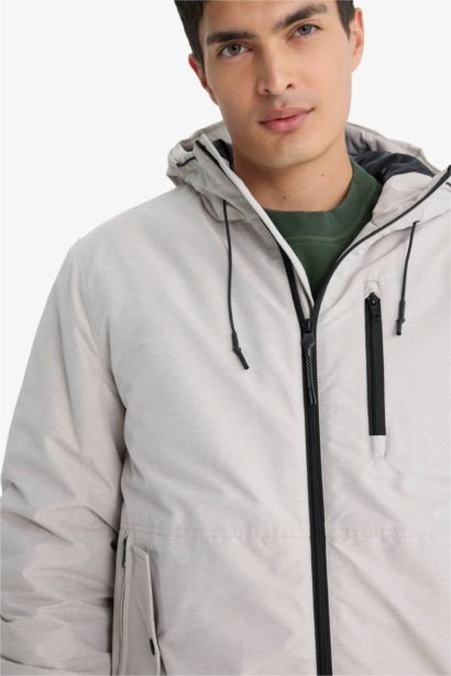 جاكيت مقاوم للماء قصة عادية بغطاء للرأس