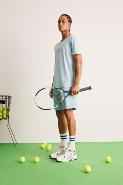 تيشيرت رياضي مطبوع قصة عادية بياخة مستديرة من DeFactoFit