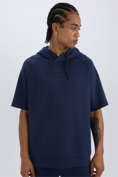 تيشيرت رياضي قصة عادية قماش سكوبا بكابيشون من DeFactoFit