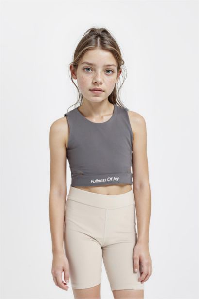 كروب توب بناتي رياضي بدون ردن بياخة مستديرة