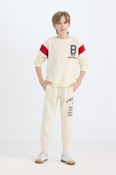 بنطلون سويت بانتس اولادي تقيل قصة عادية بأستك من تحت بيج فاتح