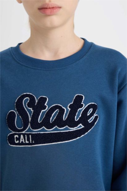 Sweat-shirt imprimé à coupe régulière et col rond