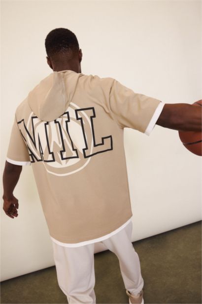 تيشيرت رياضي اوفر سايز بكابيشون من ميلووكي باكس