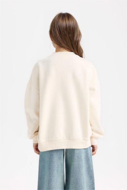 Sweatshirt imprimé à col rond et coupe relax pour fille