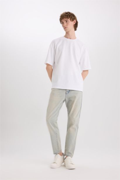 بنطلون جينز قطن 90’S سليم فيت برجل ضيقة وخصر عالي