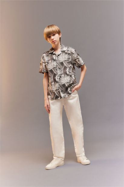 قميص بولو اولادي رمادي نص كم اوفر سايز