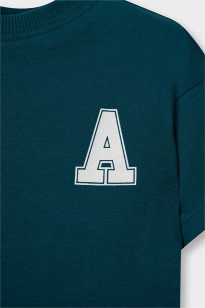 تيشيرت بيبي أولاد نص كم بطبعة شعار قصة عادية