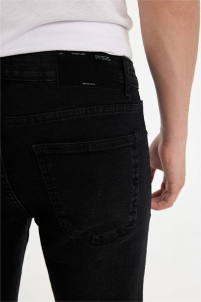 Pantalon Jean extra slim à taille normale et jambes extra étroites
