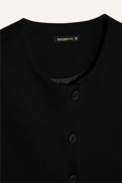 Gilet basique à col ras du cou et à boutons plats