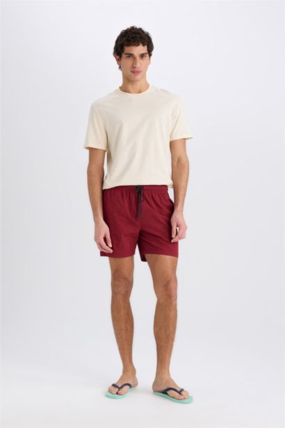 Short de bain court avec doublure