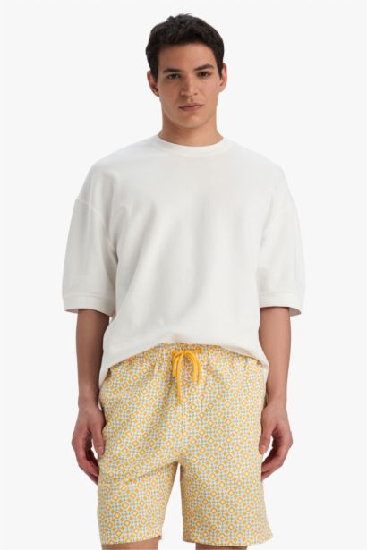 Short de bain mi-long à motifs avec doublure en filet Coupe régulière