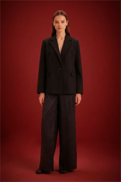 Pantalon à taille haute et jambes larges avec poches