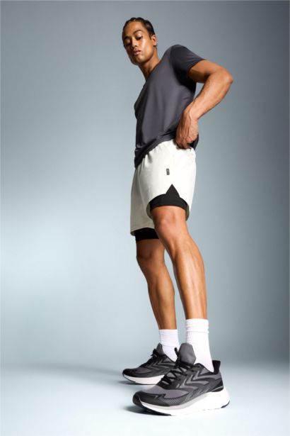 شورت رياضي سليم فيت مطبوع بليجن من DeFactoFit