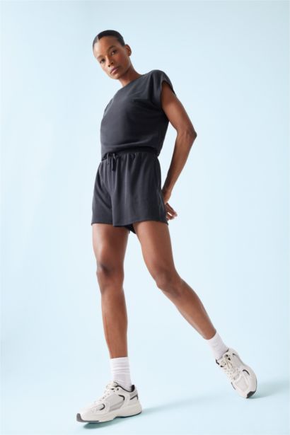 Combinaison courte avec poches et col rond en modal de DeFactoFit