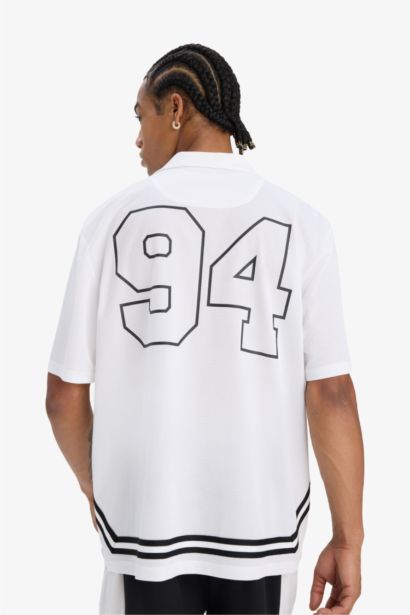 تيشيرت رياضي اوفر سايز مطبوع بياقة بولو من DeFactoFit