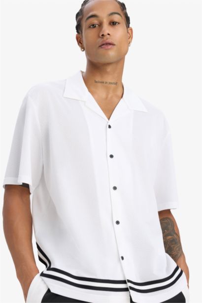 تيشيرت رياضي اوفر سايز مطبوع بياقة بولو من DeFactoFit