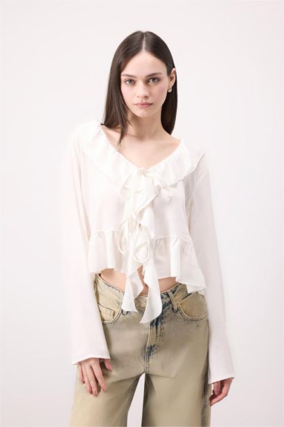 Blouse à manches longues en viscose avec nœud à coupe régulière