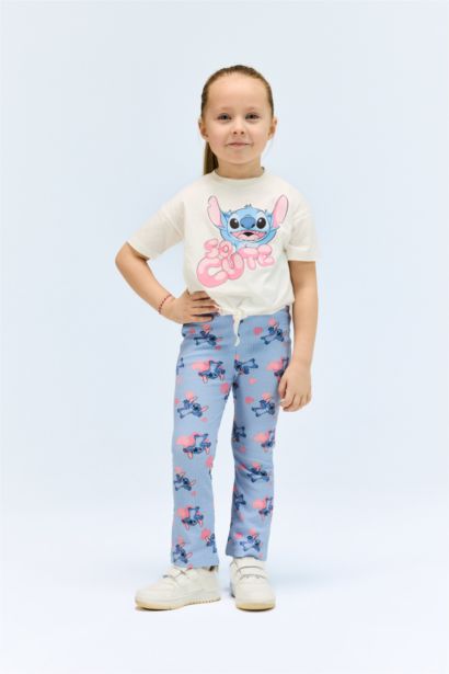 طقم من تيشيرت بنات بطبعة ستيتش و سروال ضيق