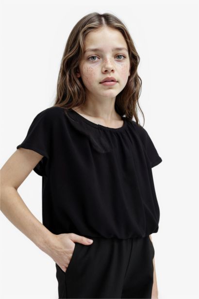 Blouse noire à manches courtes et col rond pour fille