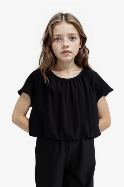 Blouse noire à manches courtes et col rond pour fille